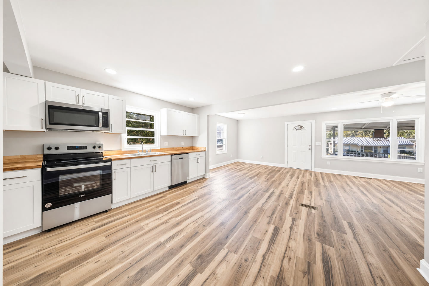 Freshly painted open kitchen and living room, new trim and ceilings, after a full interior remodel